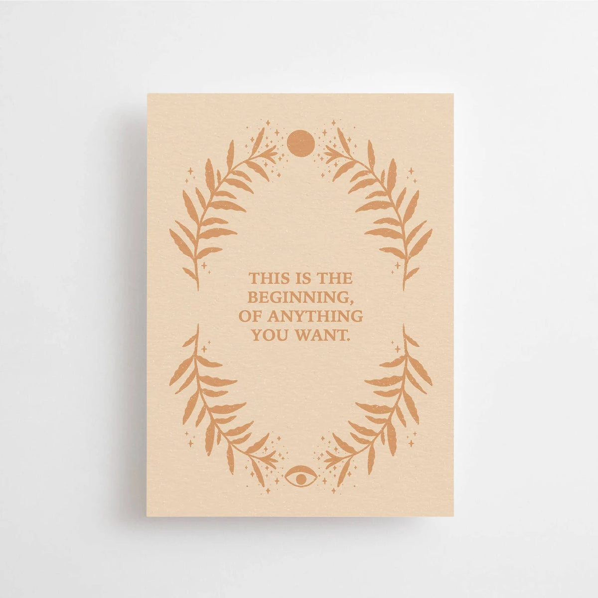 Postkarte This is the beginning of anything you want von Anna Cosma A6: eine beige Karte mit einem Kranz aus Zweigen, Sonne und Mond und dem Schriftzug „This is the beginning of anything you want“