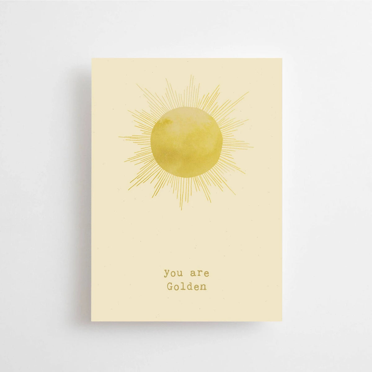 Postkarte You are golden von Anna Cosma A6: eine hellgelbe Karte mit gemalter gelber Sonne und dem Schriftzug „You are golden“