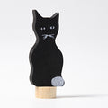Grimm's Steckfigur schwarze Katze, die schwarze Katze sitzt aufrecht auf ihrem Holzfuß