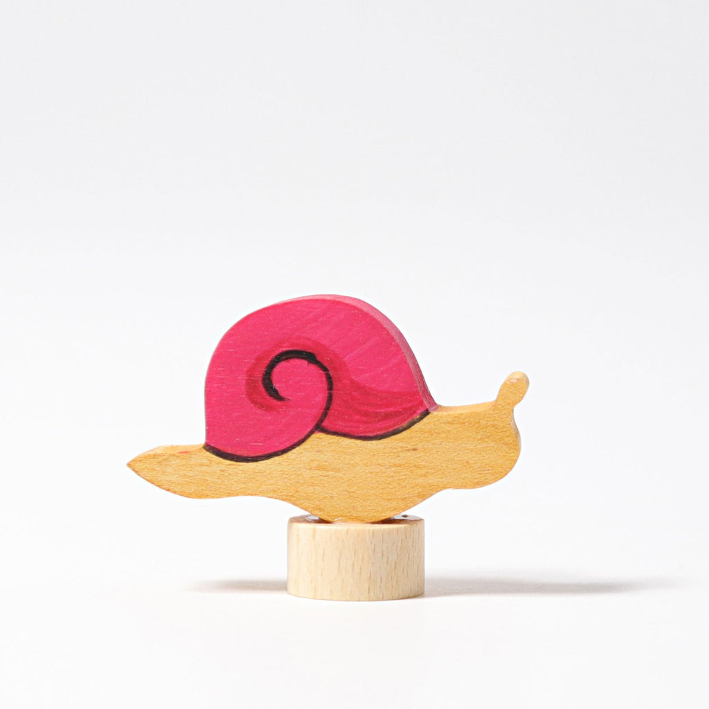Grimm's Steckfigur rosa Schnecke auf dem Festtagsring, Foto