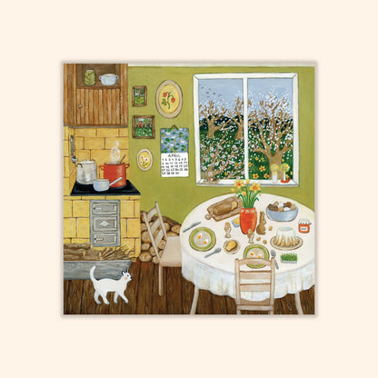 Postkarte Osterfrühstück von Asia Spettel 12 x 12 cm: eine Landhausküche mit gedecktem Ostertisch, Kuchen, Herd und einer weißen Katze, draußen blühende Bäume
