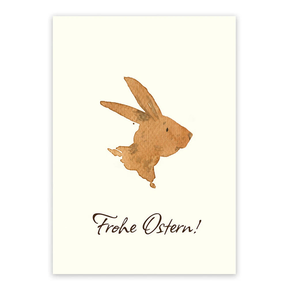 Postkarte Frohe Ostern von Corinna Schwerdtfeger A6: ein Hase in Brauntönen als Aquarell auf cremefarbenem Naturkarton, Schriftzug Frohe Ostern