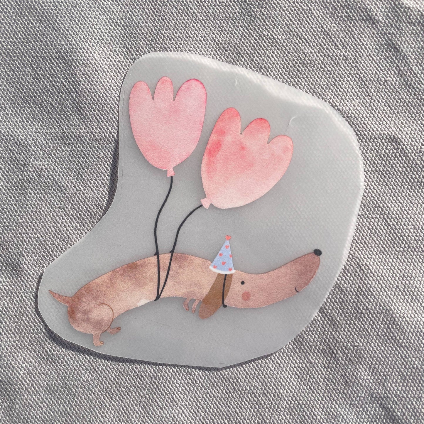 Bügelbild - Dackel mit Luftballons