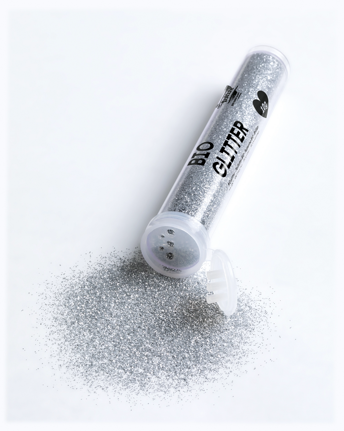 folia Bio-Glitter Silber, ausgestreut neben der Dose