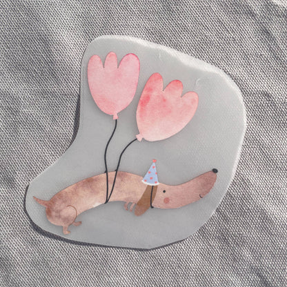 Bügelbild - Dackel mit Luftballons