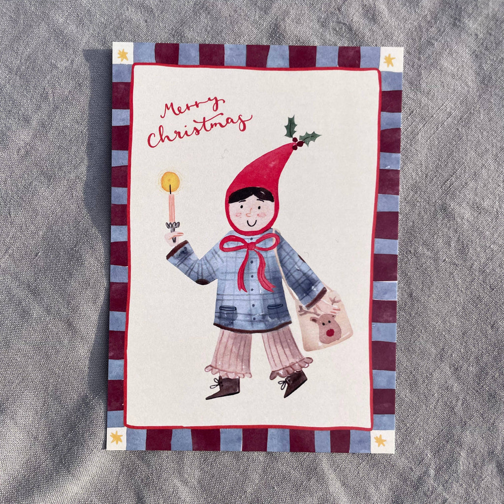 Postkarte Merry Christmas von Hannahs Firlefanz A6, Kind mit roter Zipfelmütze und Kerze