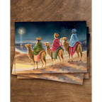 Postkarte Drei Könige von Iris Esther A6: drei Kinder mit Kronen reiten auf Kamelen unter dem Winterhimmel einem Stern entgegen