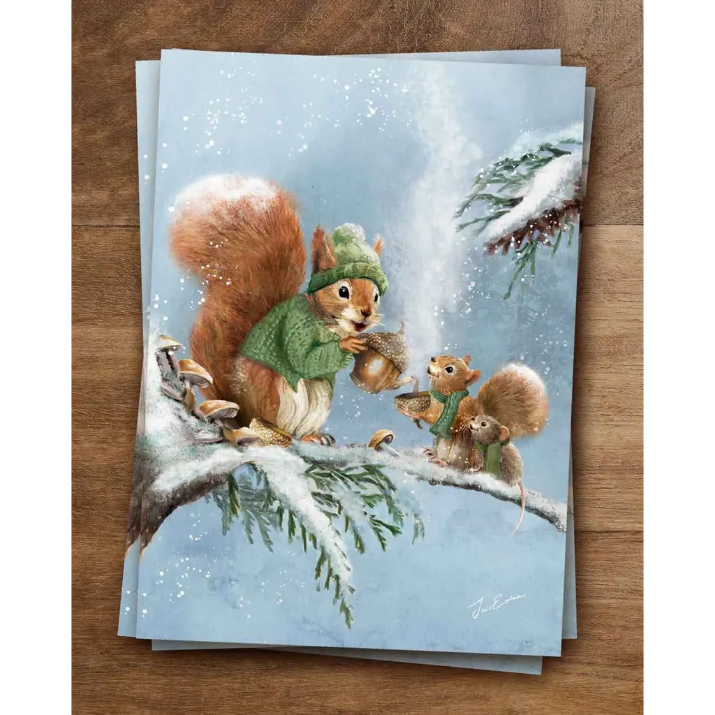 Postkarte Eicheltee von Iris Esther A6: zwei Eichhörnchen in Mütze und Strickjacke trinken auf einem verschneiten Ast Eicheltee