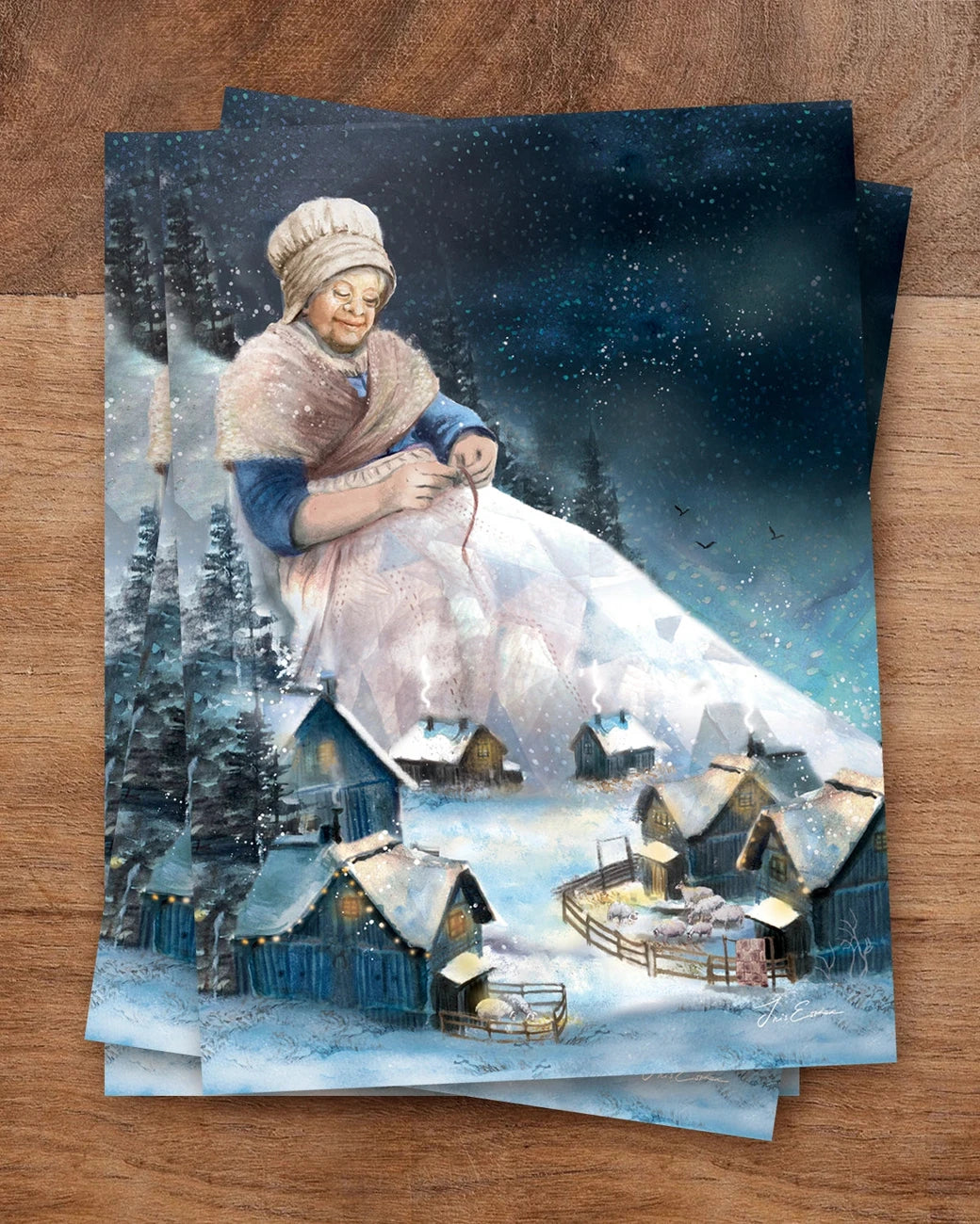 Postkarte Eine Schneedecke von Iris Esther A6: Großmutter Schnee sitzt hoch über der Welt beim Mond und näht eine Decke aus Schnee