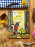 Bilderbuch Der Drache mit den roten Augen von Astrid Lindgren 2. Hand, Cover mit zwei Kindern und kleinem grünem Drachen im Stall, Foto
