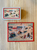 Minipuzzle Winterspaß von Penny Puzzle 99 Teile, fertig gepuzzelt neben der Schachtel