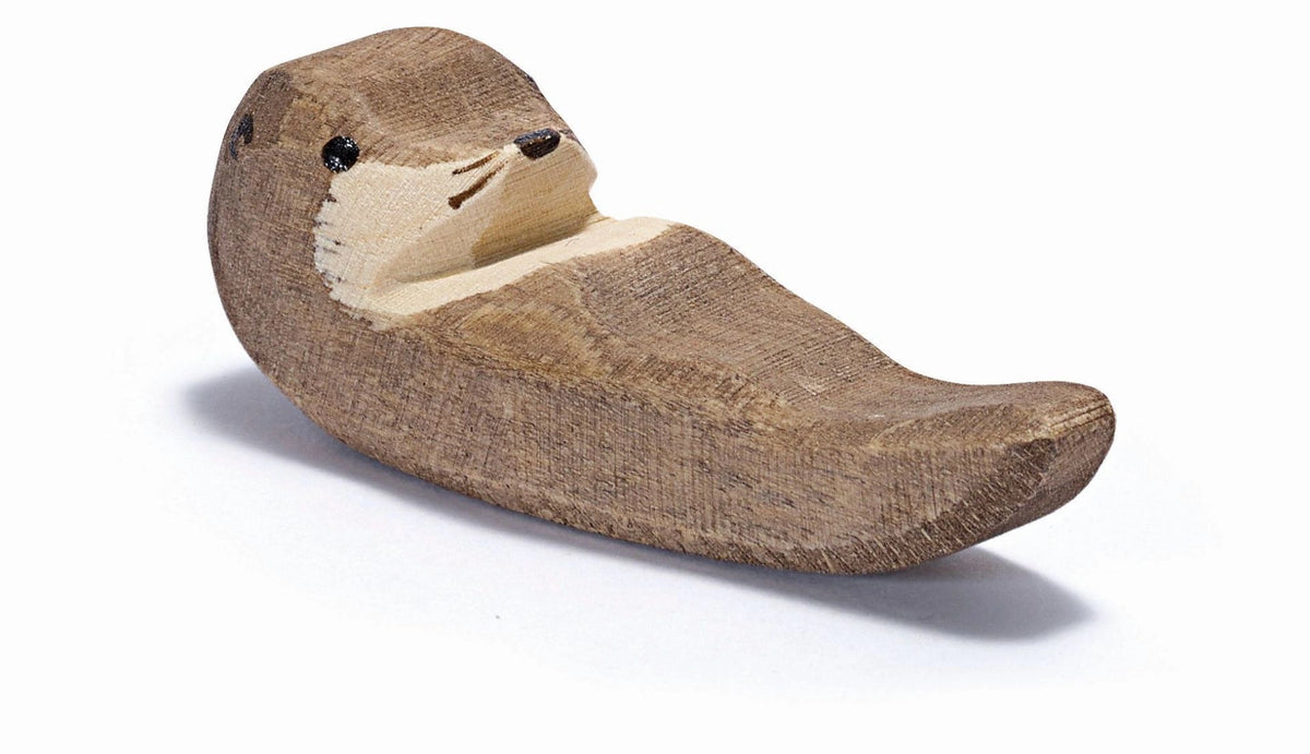 Ostheimer Seeotter klein schwimmend, Holzfigur auf dem Rücken liegend