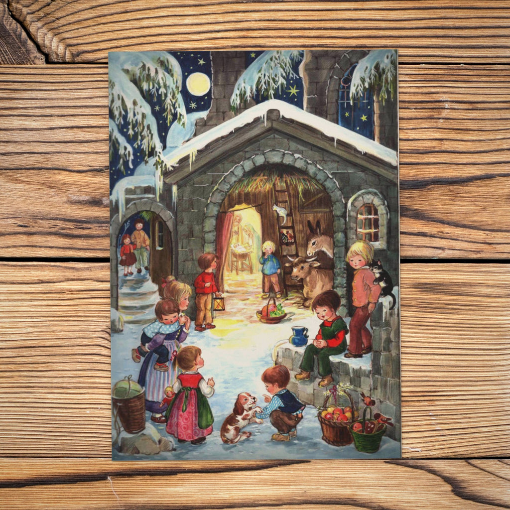 Sellmer Adventskalender Am Stall A4 auf einem Holztisch