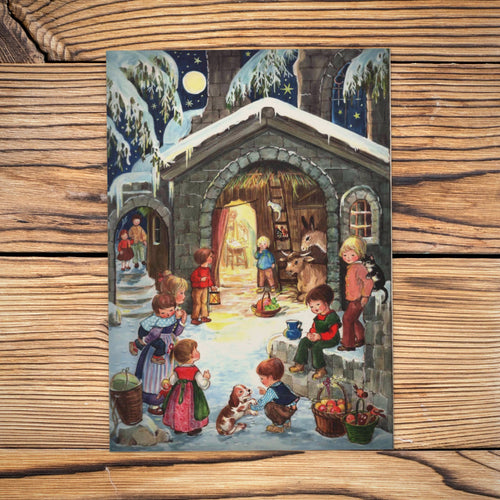 Sellmer Adventskalender Am Stall A4 auf einem Holztisch