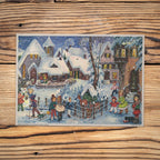Sellmer Adventskalender Es schneit A4 auf einem Holztisch