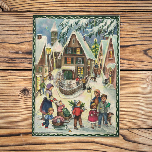 Sellmer Adventskalender Weihnachten im Dorf A4 auf einem Holztisch