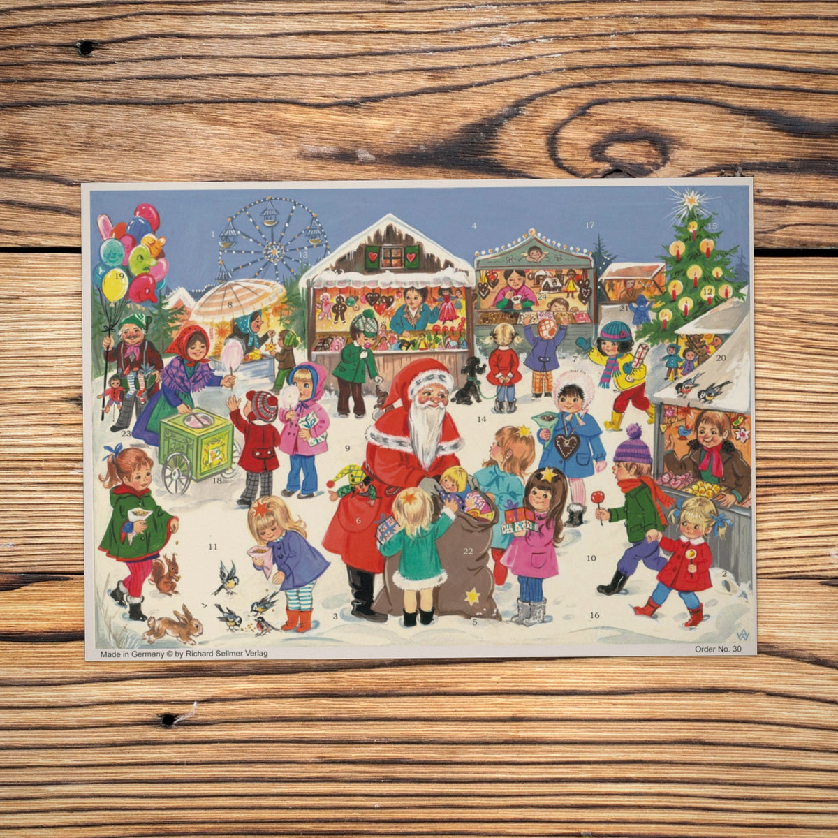 Sellmer Adventskalender Weihnachtsjahrmarkt A4 auf einem Holztisch