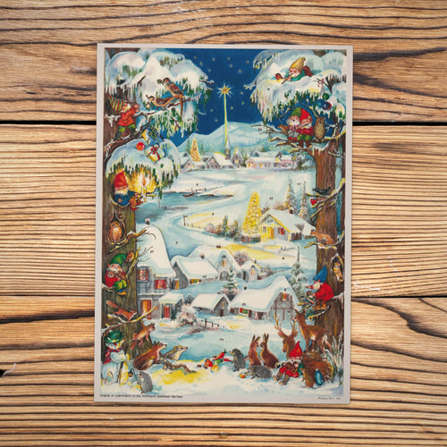 Sellmer Adventskalender Winterliches Dorf A4 auf einem Holztisch