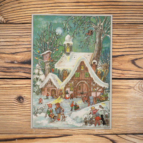 Sellmer Adventskalender Winterliches Treiben A4 auf einem Holztisch