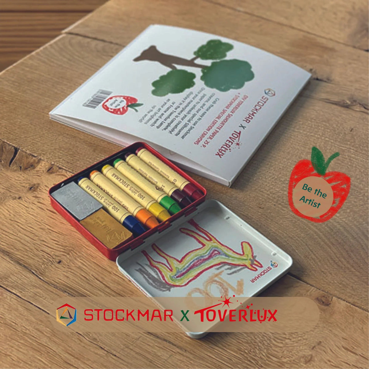 Toverlux DIY Set Stockmar Wachsmalstifte mit Motivpapier: Dose mit Wachsmalblöcken und Stiften neben dem Motivpapier